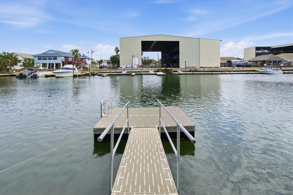 4064 Casa Court Hernando Beach, FL 34607 - Photo 28 of 32 a view of a lake with boats and large trees