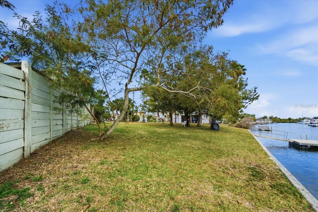 4064 Casa Court Hernando Beach, FL 34607 - Photo 29 of 32 a view of a yard with plants and trees