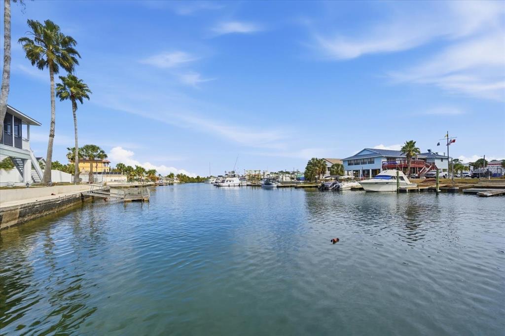 4064 Casa Court Hernando Beach, FL 34607 - Photo 32 of 32 a view of an ocean with boats and trees in the background