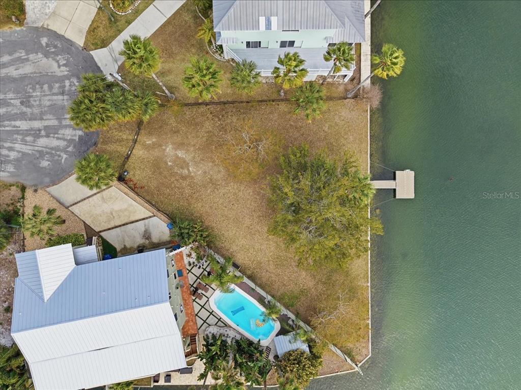 4064 Casa Court Hernando Beach, FL 34607 - Photo 4 of 32 an aerial view of a house with a yard