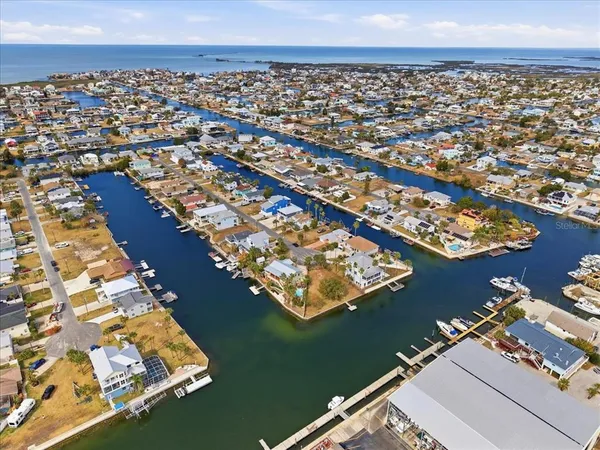 an aerial view of residential building with ocean view