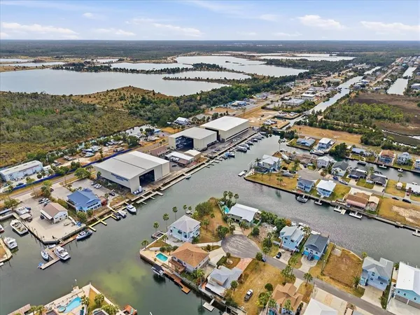 a view of a water with boats and trees in the background