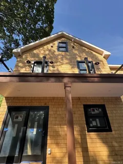 a front view of a building with glass windows