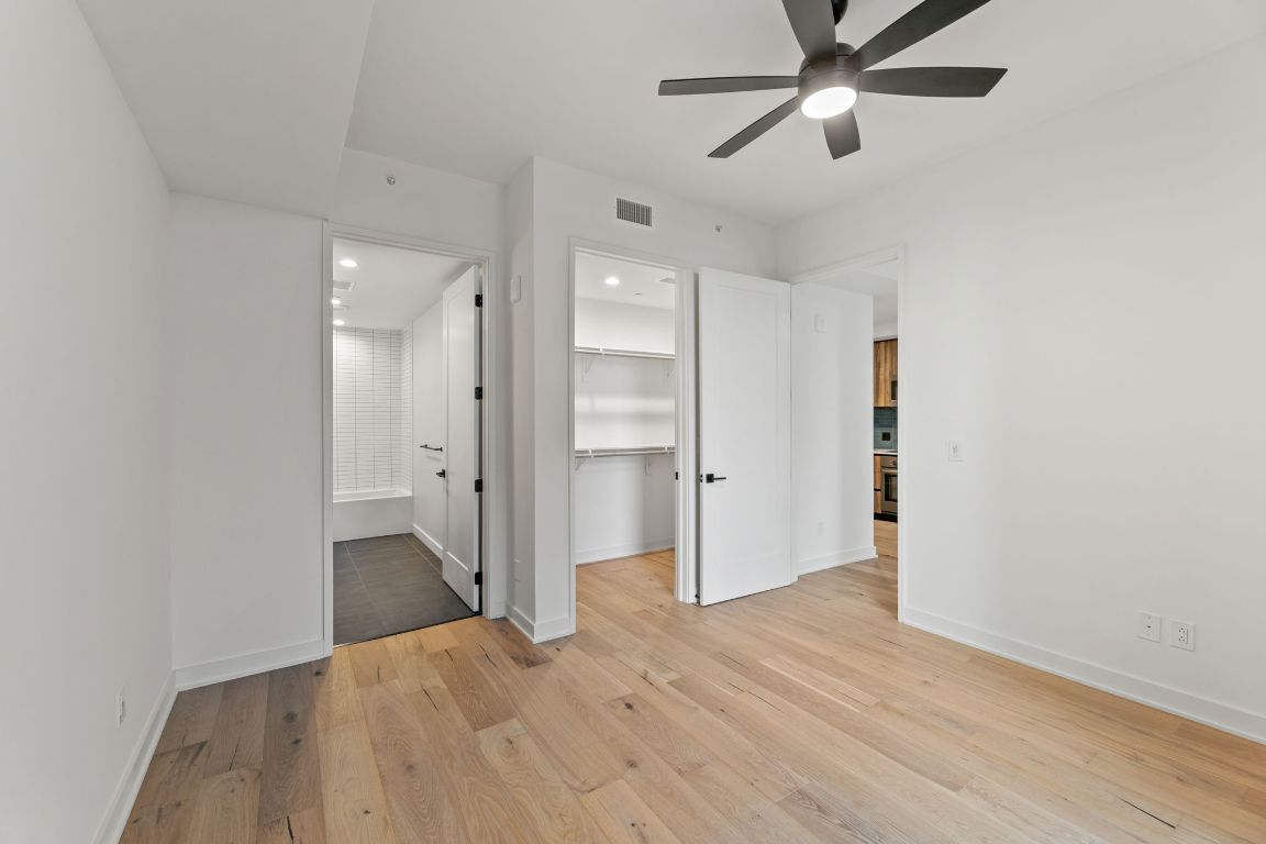84 East Avenue, Unit 2108 Austin, TX 78701 - Photo 7 of 11 a view of empty room with wooden floor