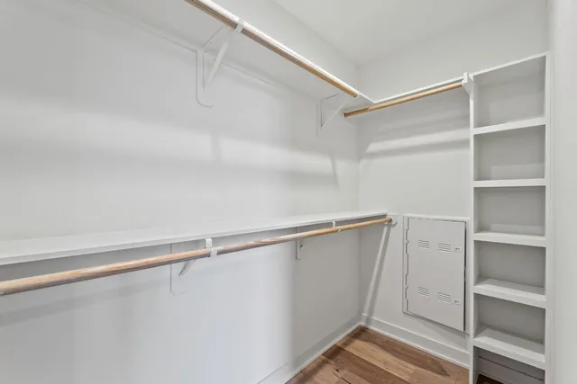 a view of an empty walk in closet