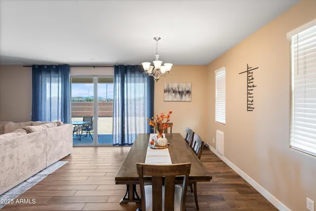 a kitchen with kitchen island granite countertop a sink and cabinets