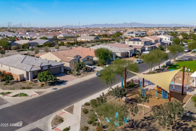 an aerial view of residential building and ocean