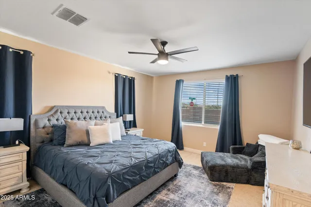 a living room with furniture and view of kitchen