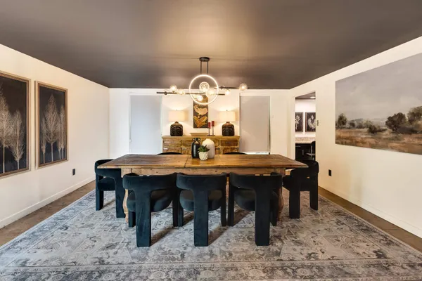 a kitchen with kitchen island a sink appliances and a large window