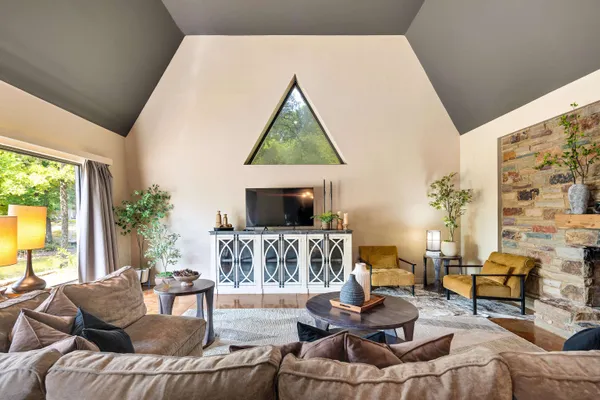 a living room with furniture and a flat screen tv