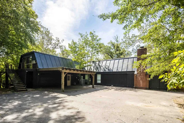 a view of a lake with houses in the background