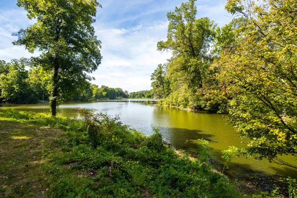 a view of a lake with houses in the background