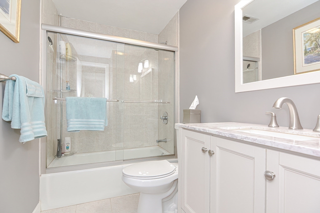 61 Mill Pond, Unit 61 North Andover, MA 01845 - Photo 13 of 31 a bathroom with a sink toilet and shower