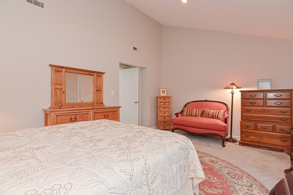 61 Mill Pond, Unit 61 North Andover, MA 01845 - Photo 19 of 31 a bedroom with a bed and a couch