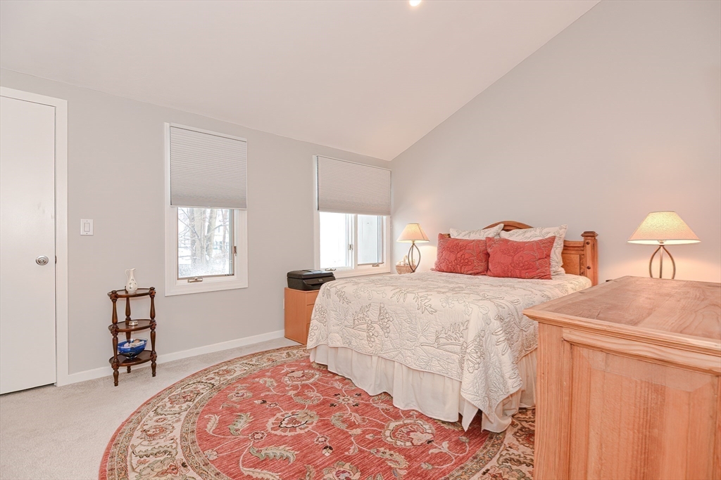 61 Mill Pond, Unit 61 North Andover, MA 01845 - Photo 21 of 31 a bedroom with double bed and a window