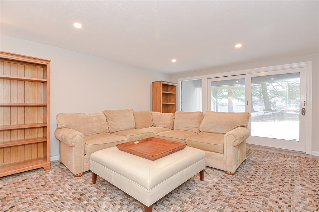 61 Mill Pond, Unit 61 North Andover, MA 01845 - Photo 23 of 31 a living room with furniture and a window