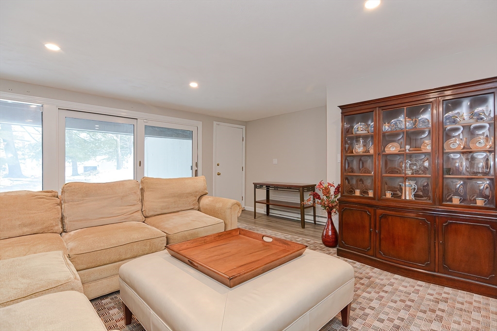 61 Mill Pond, Unit 61 North Andover, MA 01845 - Photo 24 of 31 a living room with furniture and a window
