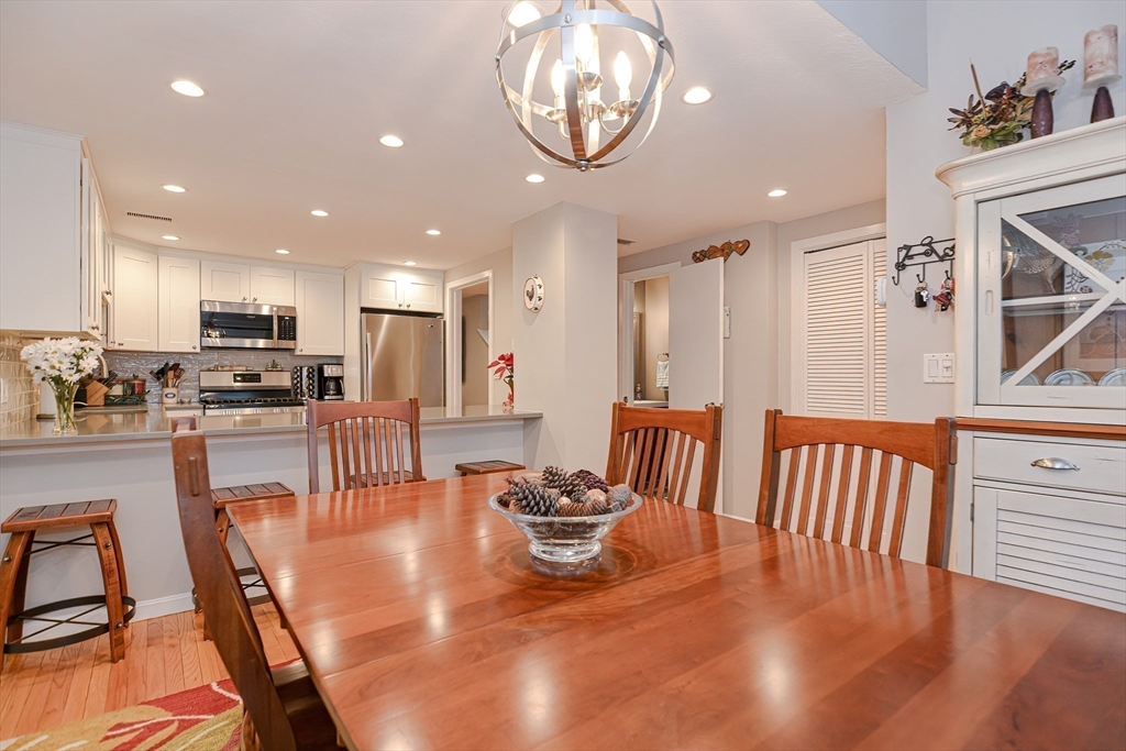 61 Mill Pond, Unit 61 North Andover, MA 01845 - Photo 7 of 31 a view of a dining room with furniture