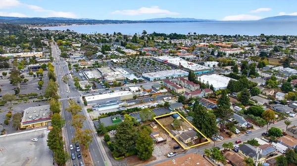 an aerial view of residential building with green space