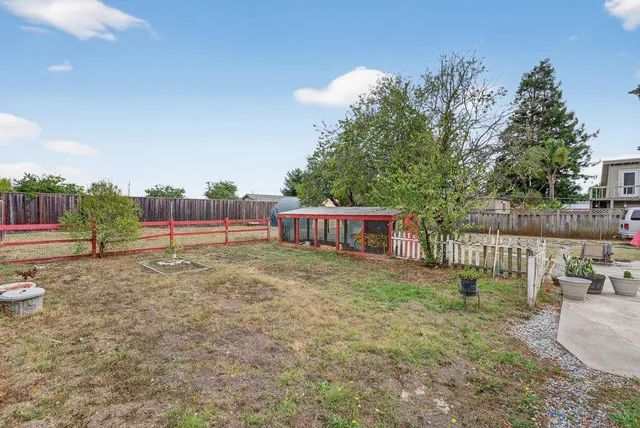 a view of backyard and deck