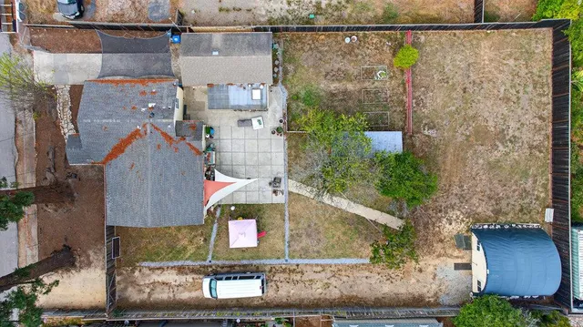 a view of house with yard