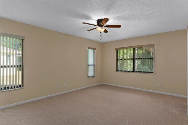 an empty room with closet and wooden floor