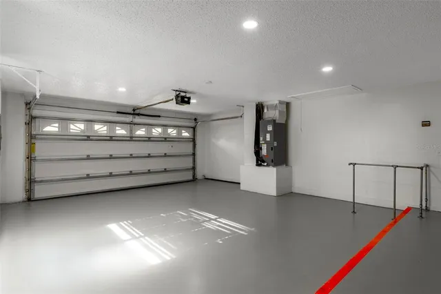 a view of a livingroom with fireplace and workspace