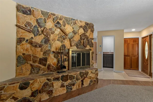 a bed room with a bed and a chair