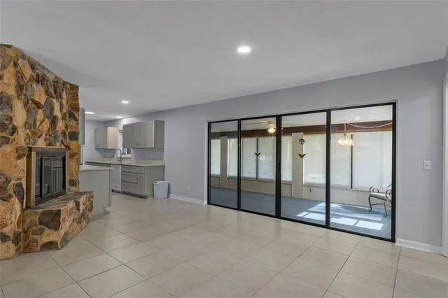 a view of a electric room an empty room and kitchen view