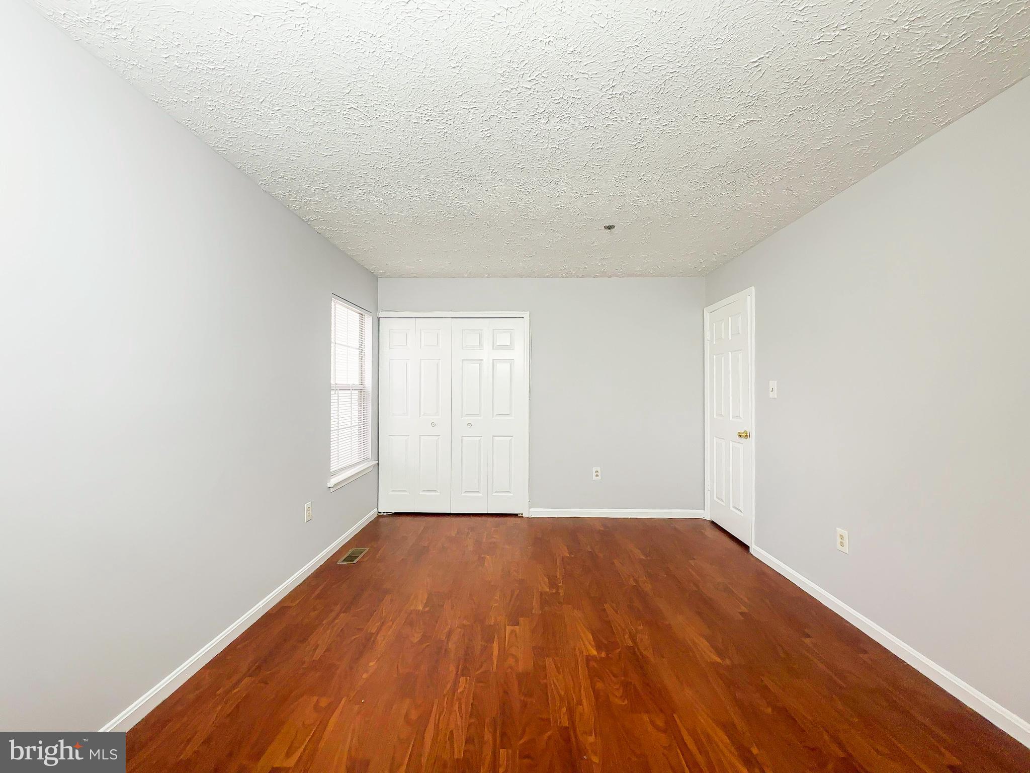 3714 Silver Park Court Suitland, MD 20746 - Photo 12 of 26 a view of empty room with wooden floor and fan