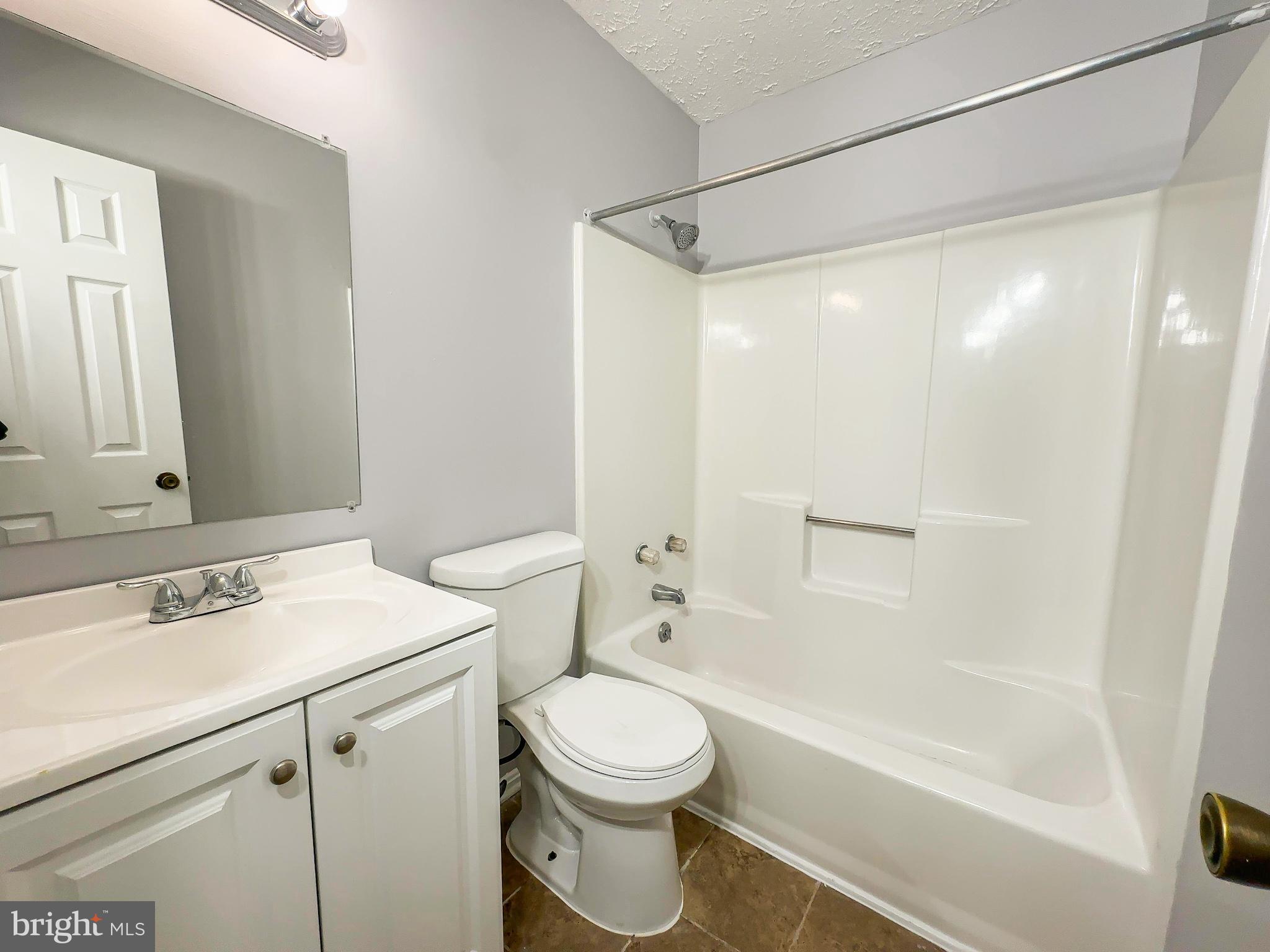 3714 Silver Park Court Suitland, MD 20746 - Photo 14 of 26 a bathroom with a sink a toilet and a mirror