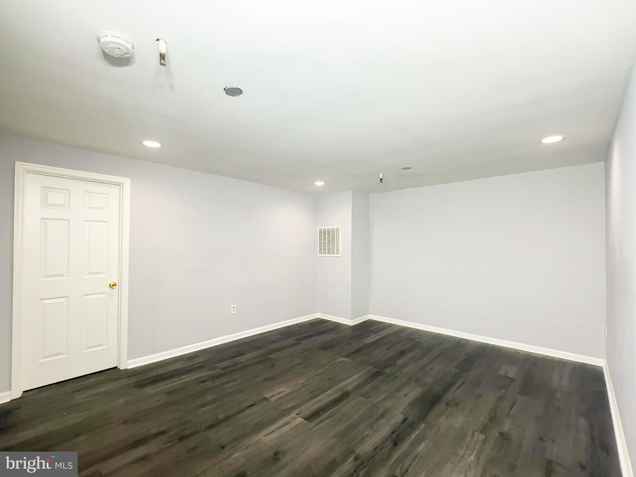 3714 Silver Park Court Suitland, MD 20746 - Photo 24 of 26 a view of an empty room with wooden floor