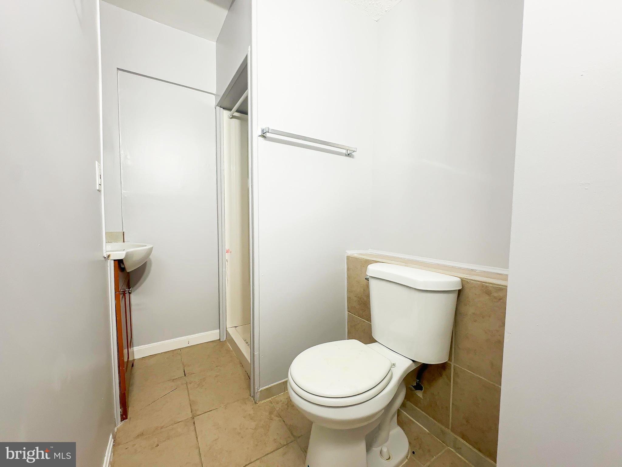 3714 Silver Park Court Suitland, MD 20746 - Photo 25 of 26 a bathroom with a toilet and a shower