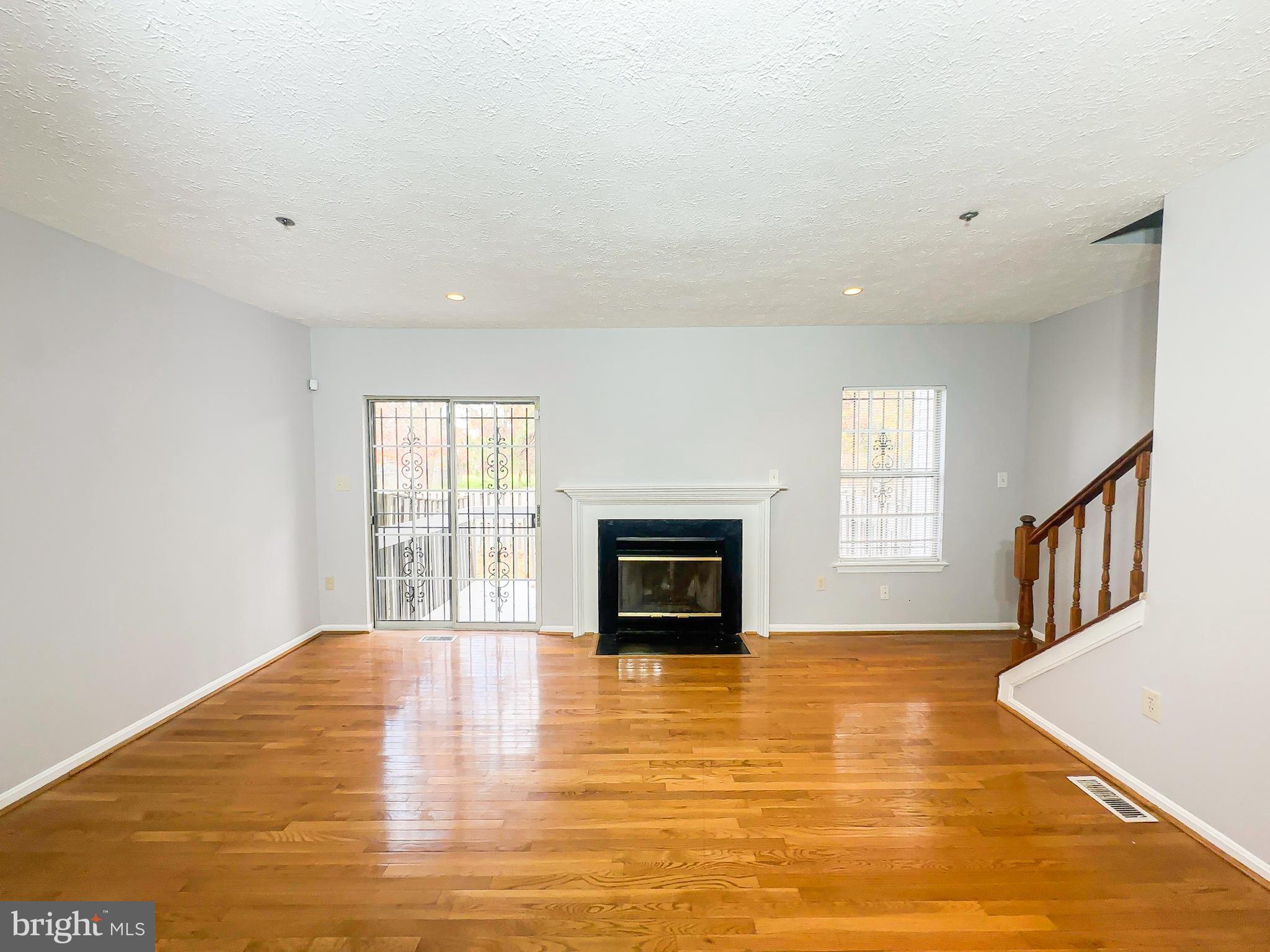 3714 Silver Park Court Suitland, MD 20746 - Photo 3 of 26 a view of an empty room with a window and fire place