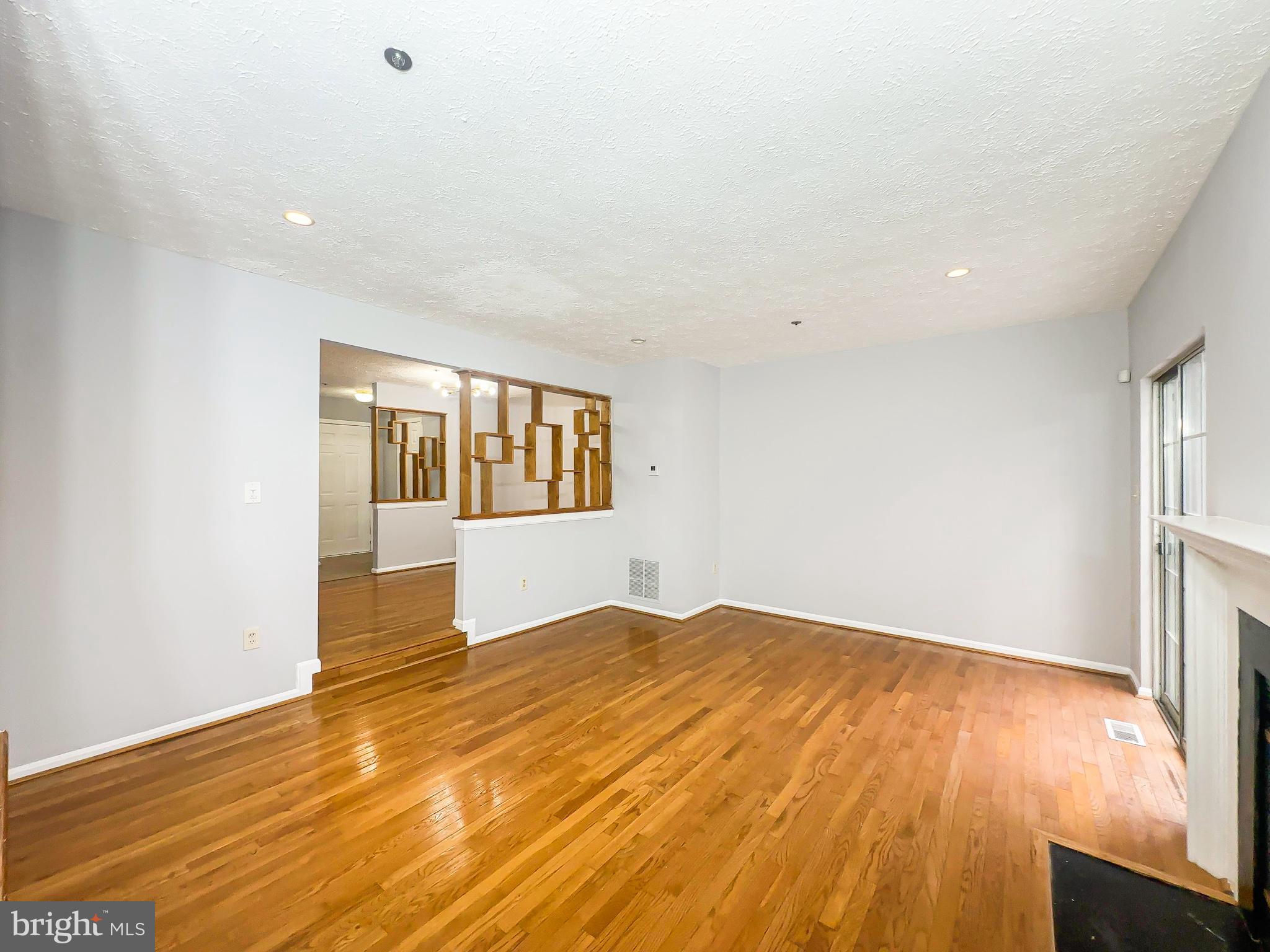 3714 Silver Park Court Suitland, MD 20746 - Photo 5 of 26 a view of empty room with wooden floor and fan