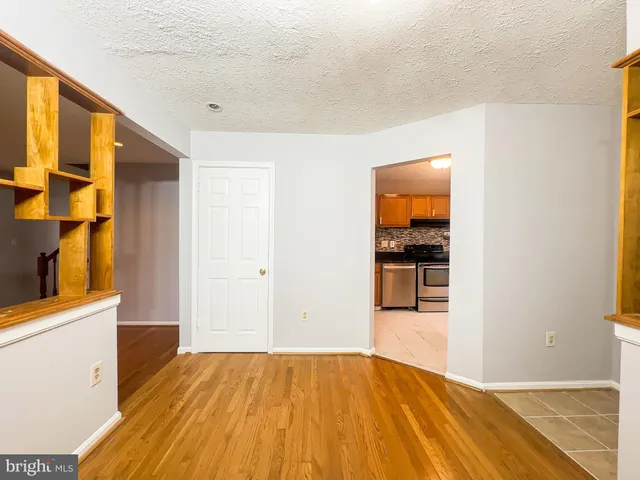 a view of a kitchen cabinets and wooden floor