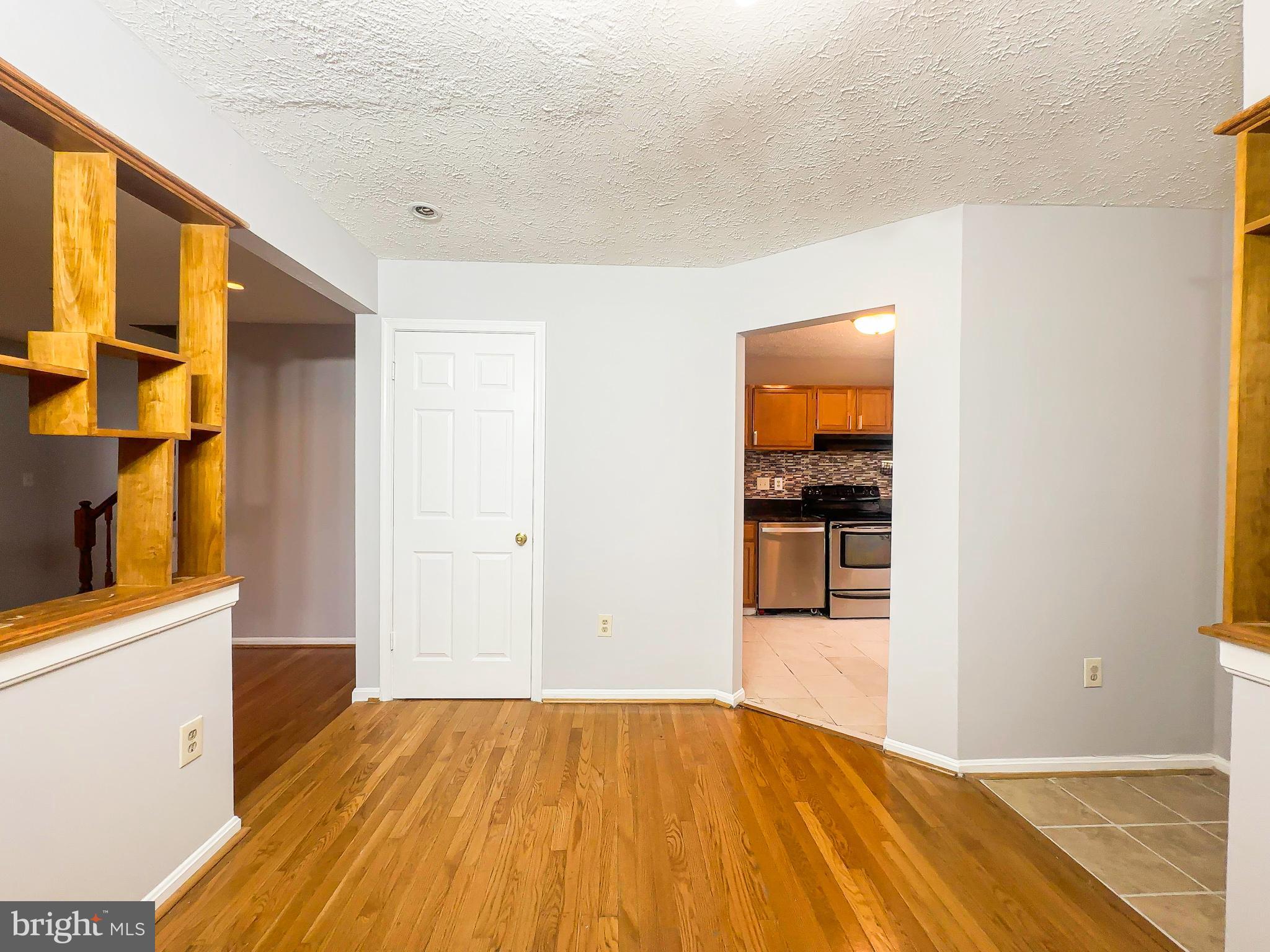 3714 Silver Park Court Suitland, MD 20746 - Photo 7 of 26 a view of a kitchen cabinets and wooden floor