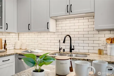 a kitchen with a sink and a stove
