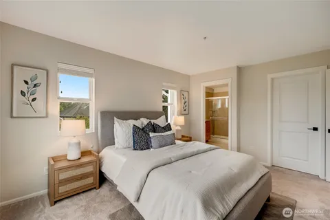 a bedroom with a bed and a night lamp