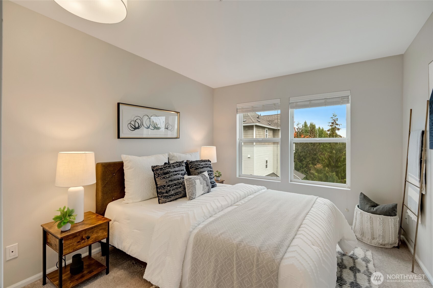 2800 Southwest Raymond Street, Unit 207 Seattle, WA 98126 - Photo 27 of 38 a bedroom with a bed and wooden floor