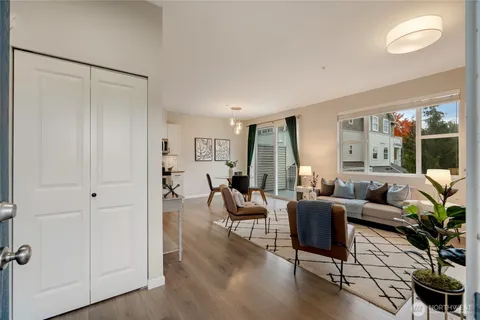 a living room with furniture and a large window