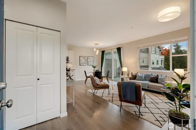 a living room with furniture and a large window