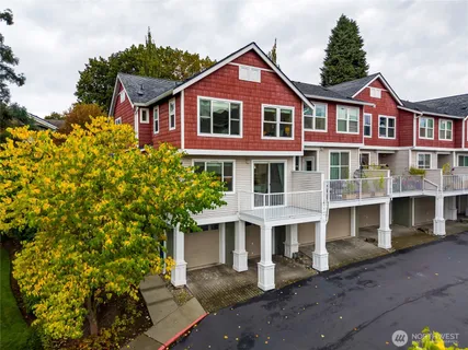 a front view of a residential apartment building with a yard