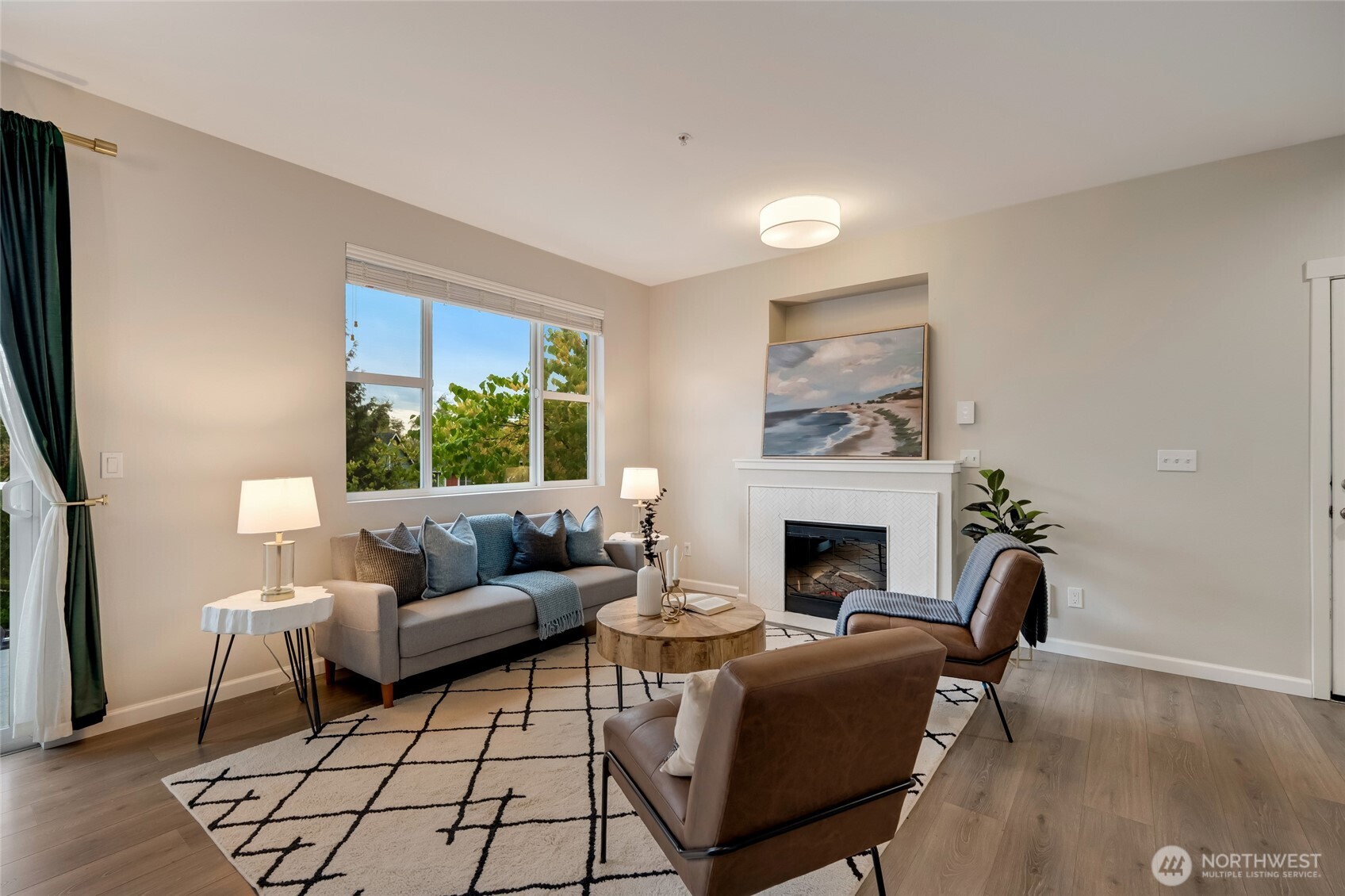 2800 Southwest Raymond Street, Unit 207 Seattle, WA 98126 - Photo 5 of 38 a living room with furniture and a fireplace