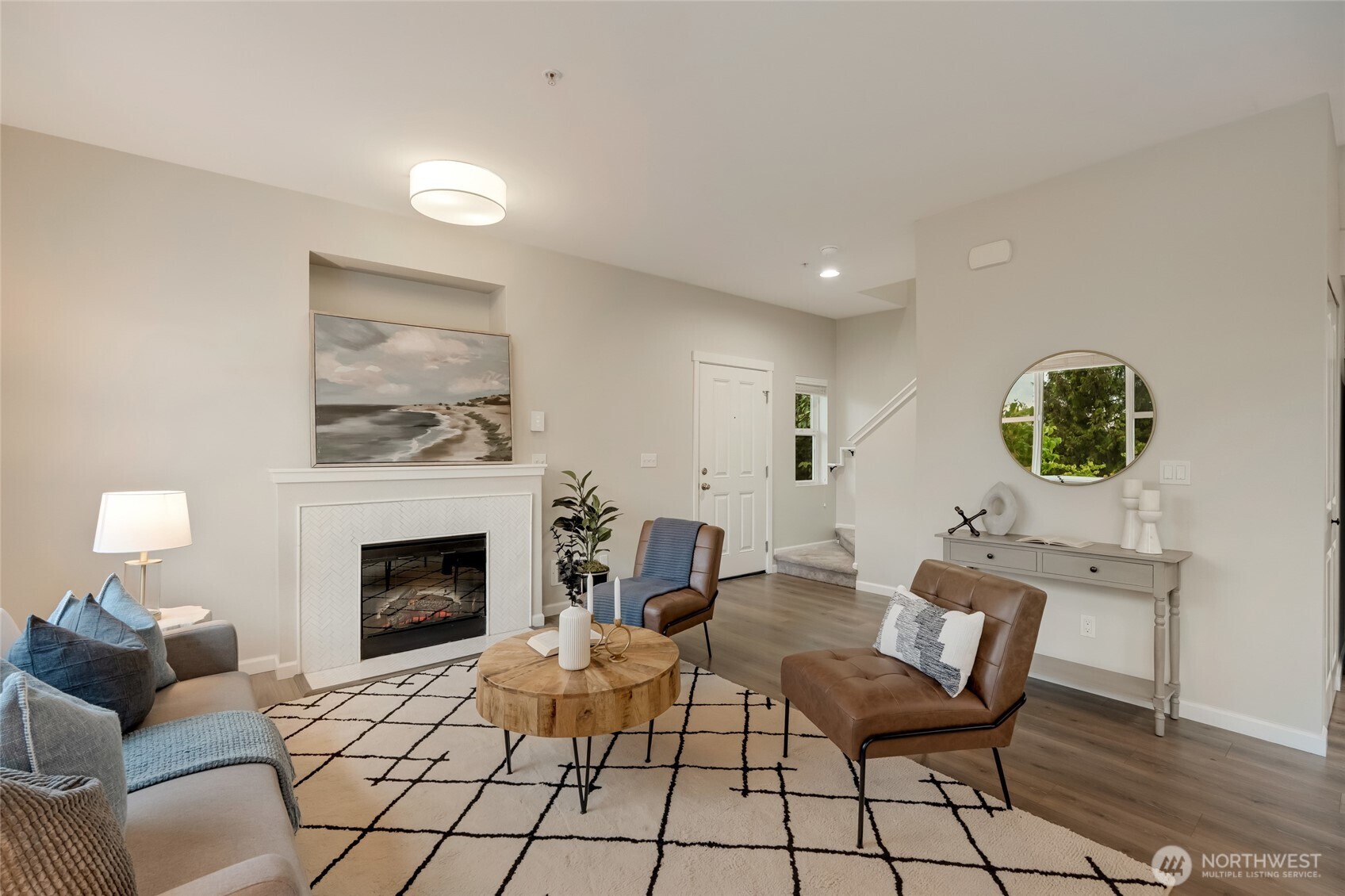 2800 Southwest Raymond Street, Unit 207 Seattle, WA 98126 - Photo 6 of 38 a living room with furniture and a fireplace