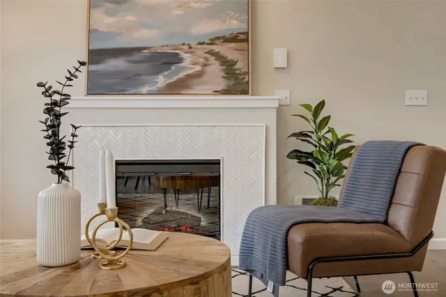 a view of a livingroom with furniture and a potted plant