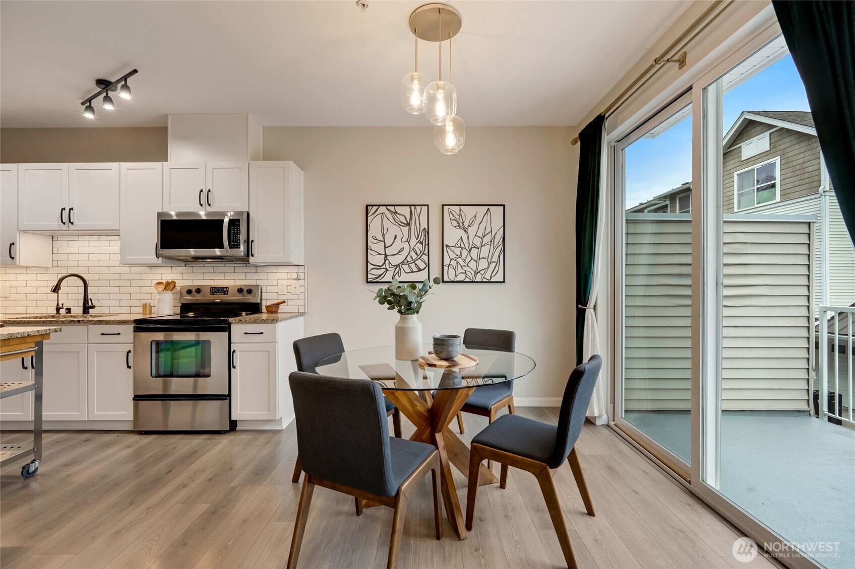 2800 Southwest Raymond Street, Unit 207 Seattle, WA 98126 - Photo 9 of 38 a view of a dining room with furniture and wooden floor