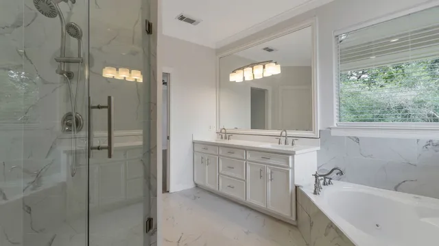 a bathroom with a double vanity sink and a mirror