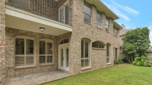 a balcony with trees in front of it
