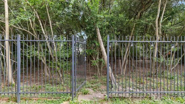 an aerial view of a house with garden space and street view